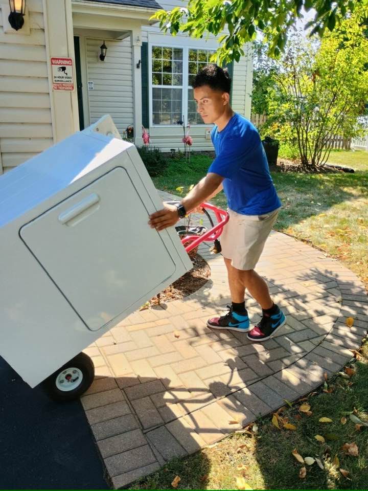 Worker with dryer on a dolly